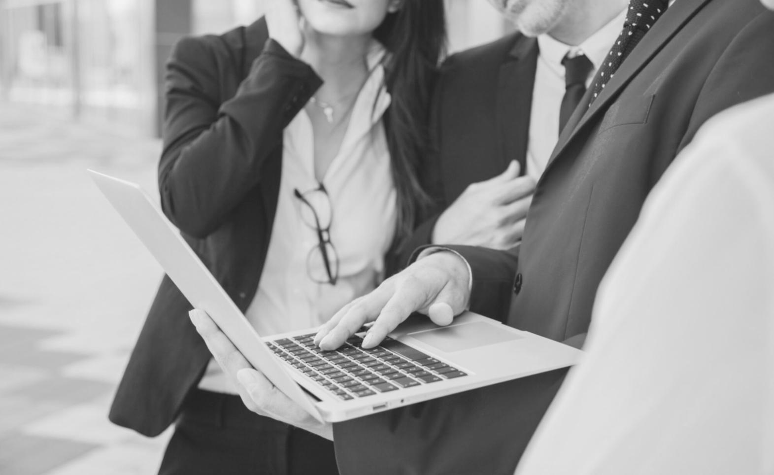 Business planning workshop session with financial models and strategy documents